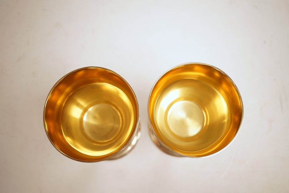 A pair of modern silver Lincoln Cathedral commemorative chalices, no.75 & 76, by John Cussell, London, 1977, 14.7cm, 13oz.